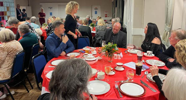 A crowded village hall at our 2023 New Year party