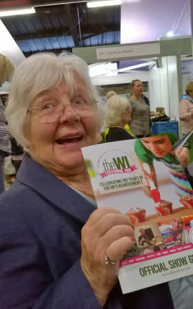 Our president, Margaret, holding up a copy of the show guid